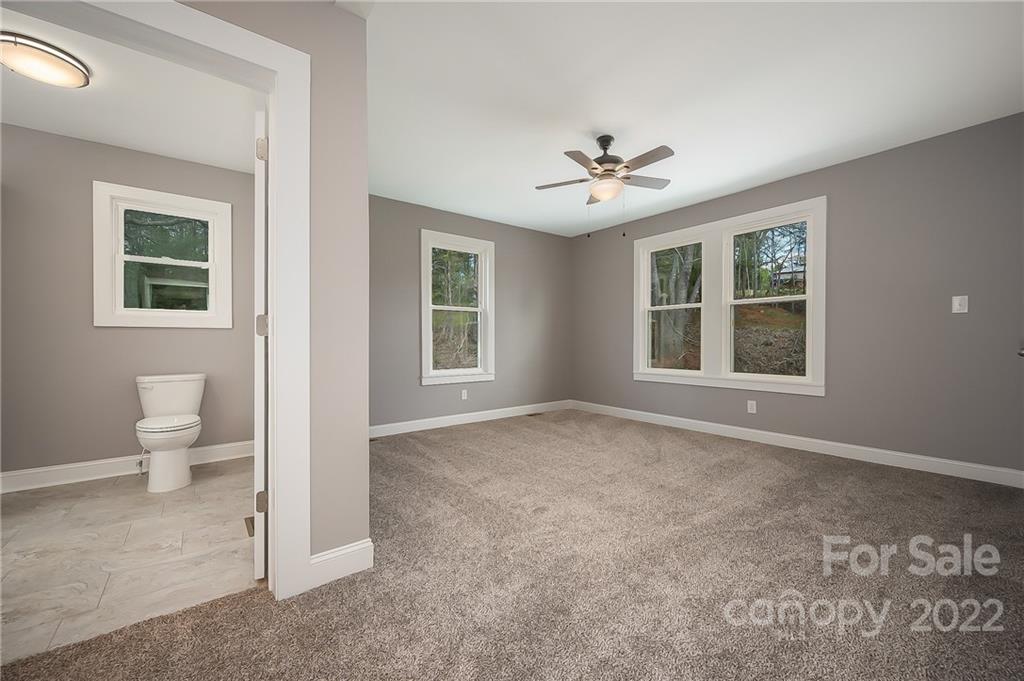1141 Highway 64 Rutherfordton, NC 28139 - Photo 24 of 37 a view of an empty room with a window and bathroom