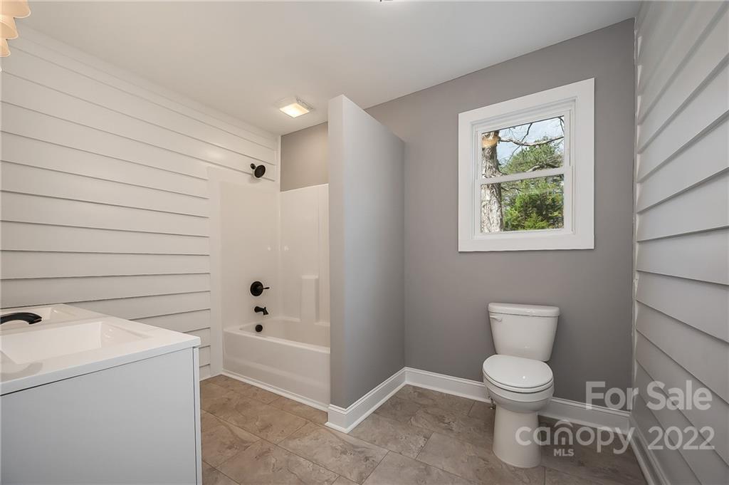 1141 Highway 64 Rutherfordton, NC 28139 - Photo 27 of 37 a bathroom with a toilet a sink and bath tub