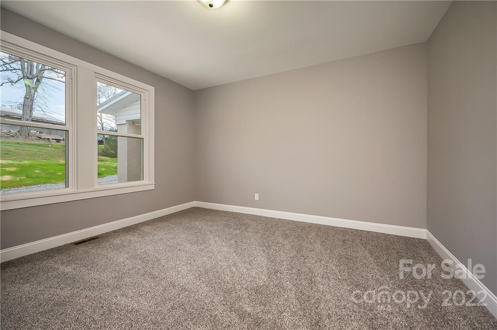 1141 Highway 64 Rutherfordton, NC 28139 - Photo 28 of 37 an empty room with a window