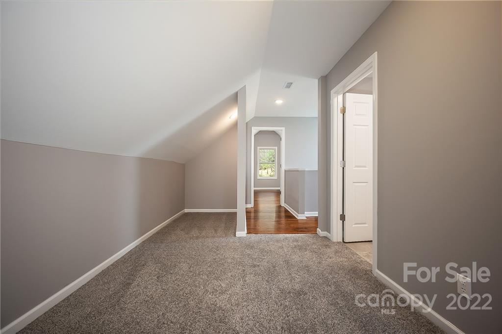 1141 Highway 64 Rutherfordton, NC 28139 - Photo 35 of 37 an empty room with closet and mirror