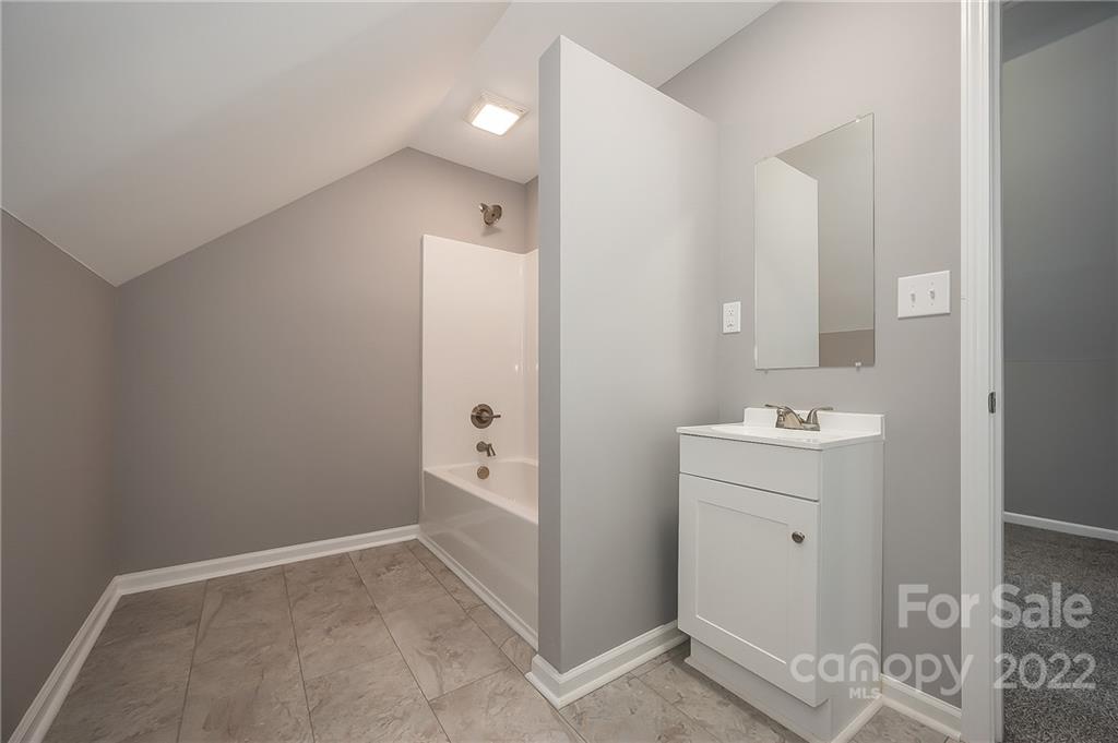 1141 Highway 64 Rutherfordton, NC 28139 - Photo 36 of 37 a bathroom with a sink and mirror