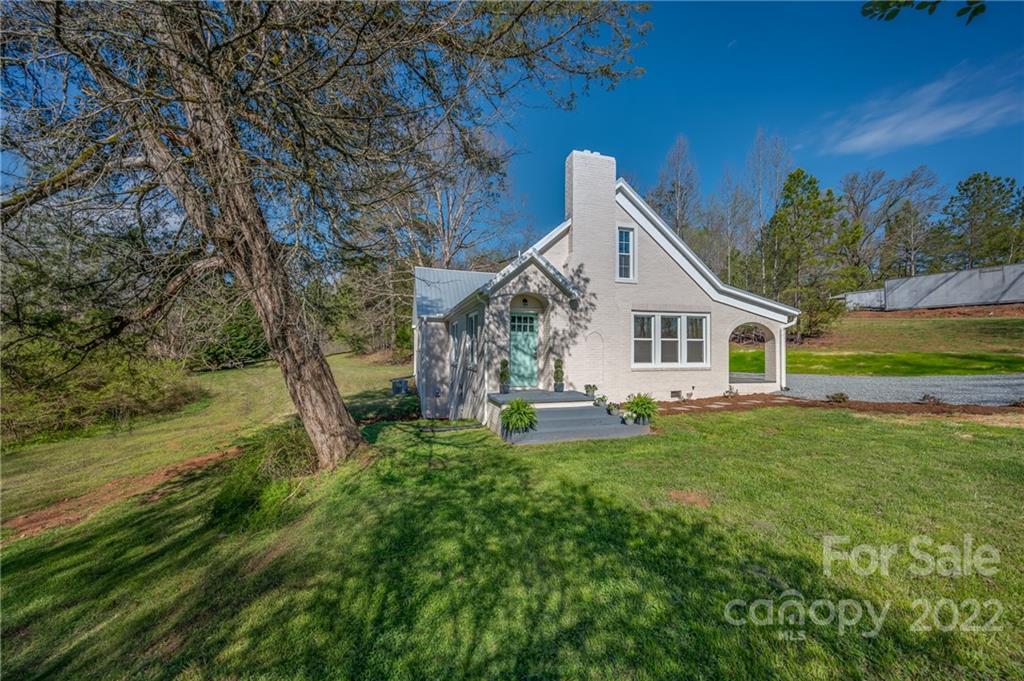 1141 Highway 64 Rutherfordton, NC 28139 - Photo 4 of 37 a front view of a house with garden