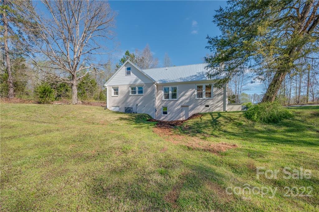 1141 Highway 64 Rutherfordton, NC 28139 - Photo 6 of 37 front view of a house with a big yard