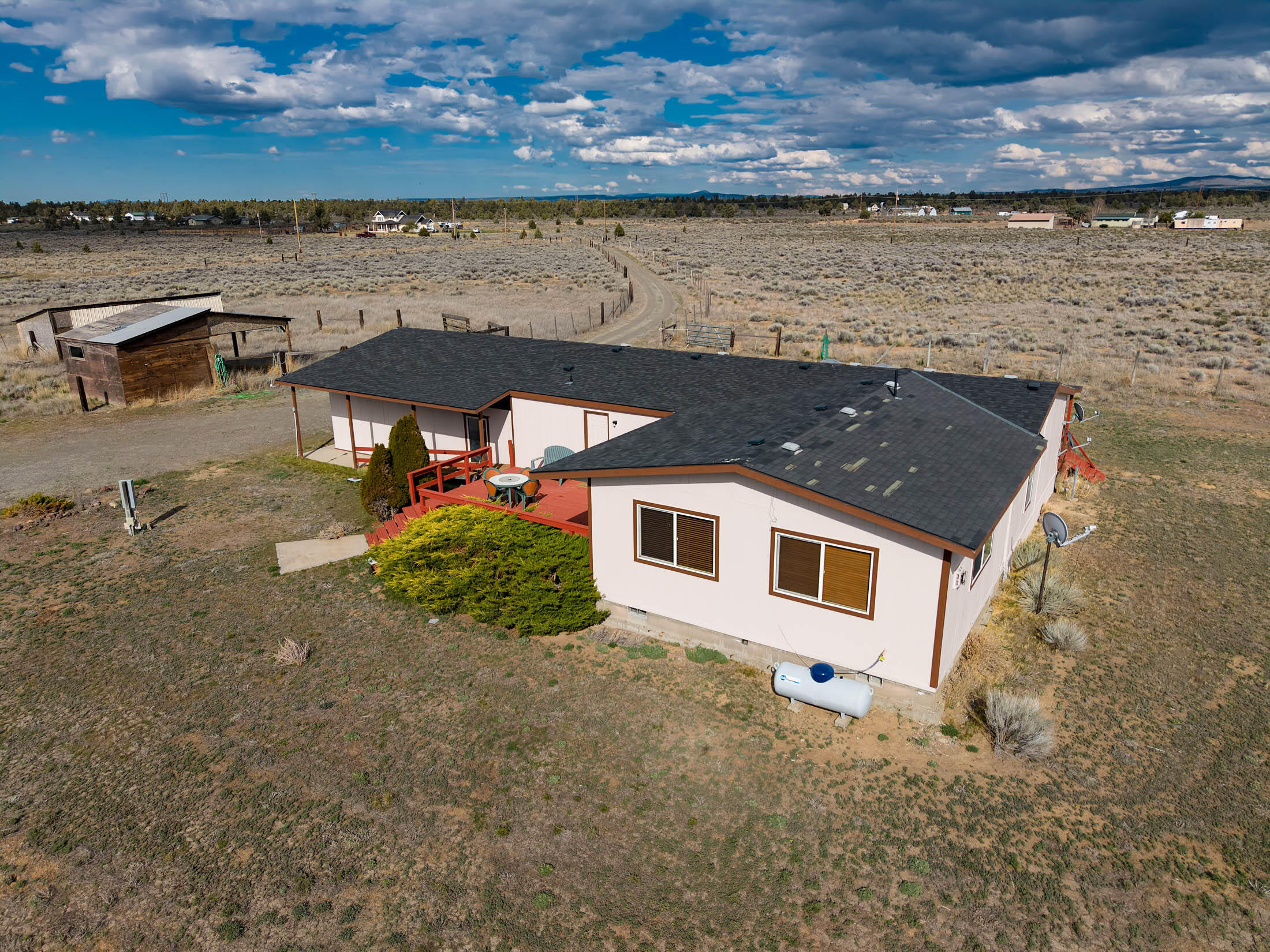 25907 South Cooper Street Bend, OR 97701 - Photo 23 of 34 a aerial view of a house with a lake view