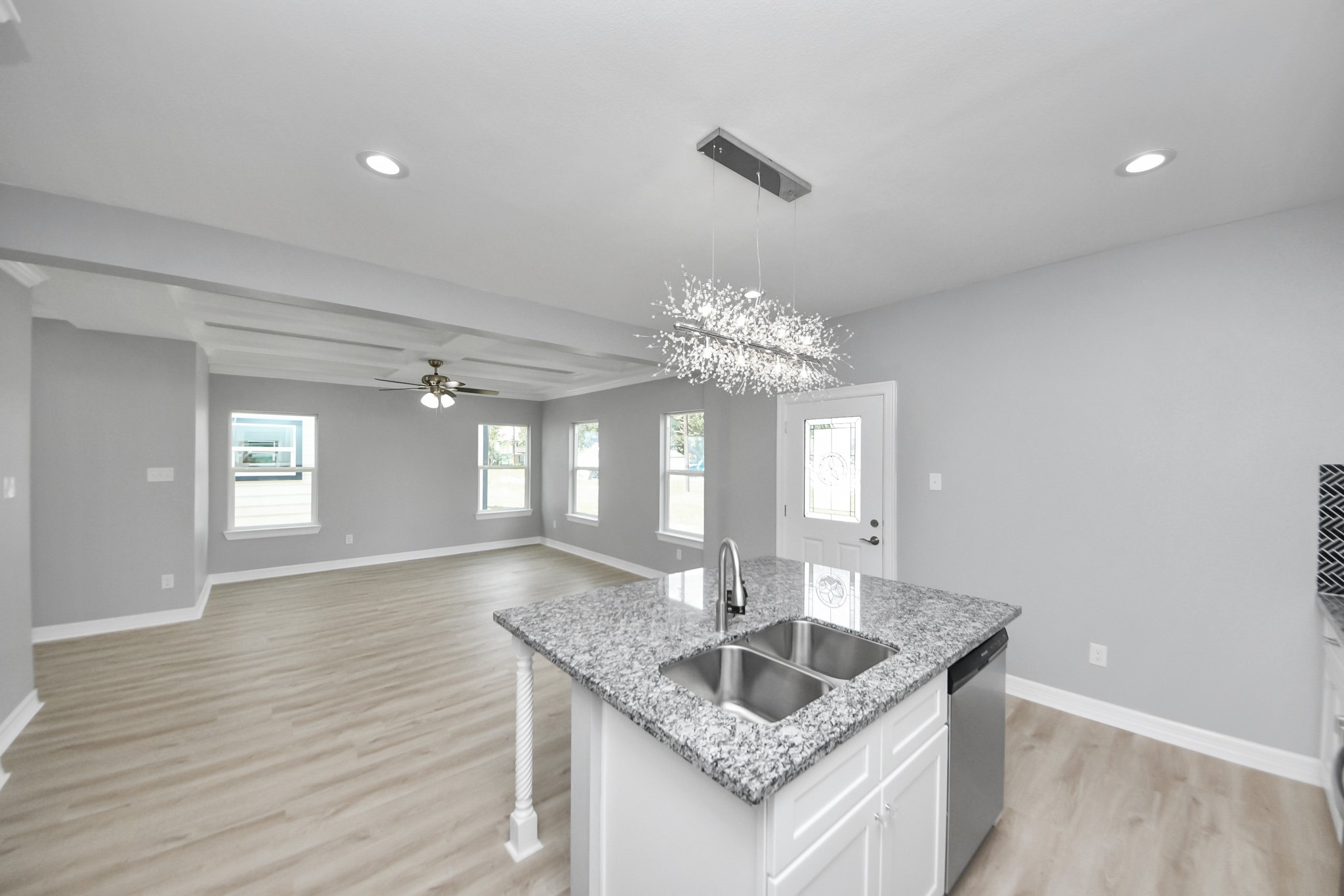 406 North 4th Street Beasley, TX 77417 - Photo 11 of 29 a view of kitchen with granite countertop microwave and wooden floor