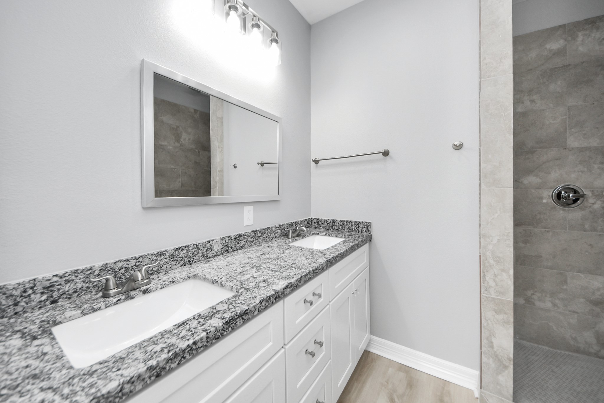 406 North 4th Street Beasley, TX 77417 - Photo 17 of 29 a bathroom with a granite countertop sink and a mirror