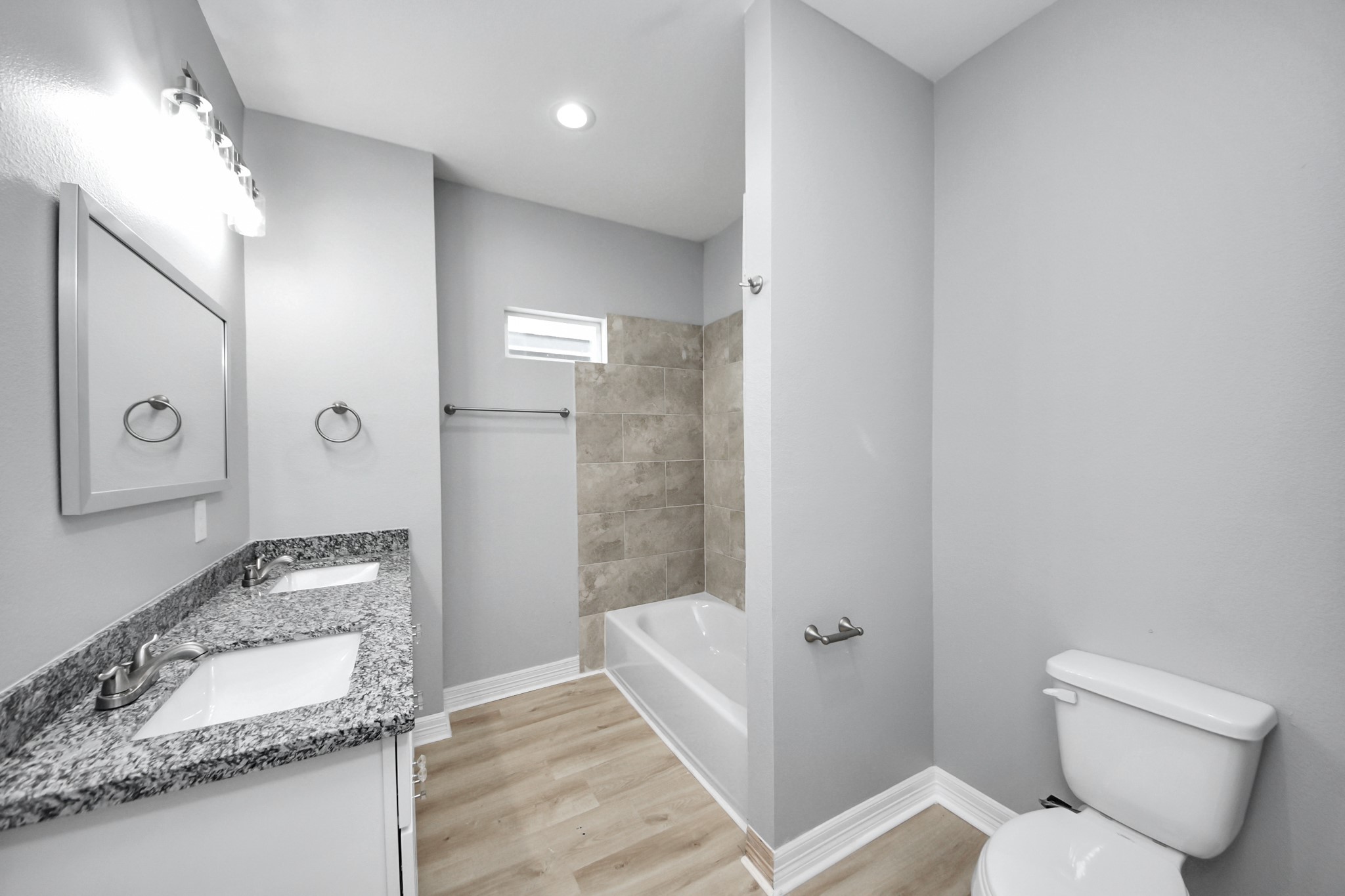 406 North 4th Street Beasley, TX 77417 - Photo 20 of 29 a bathroom with a granite countertop sink and a mirror