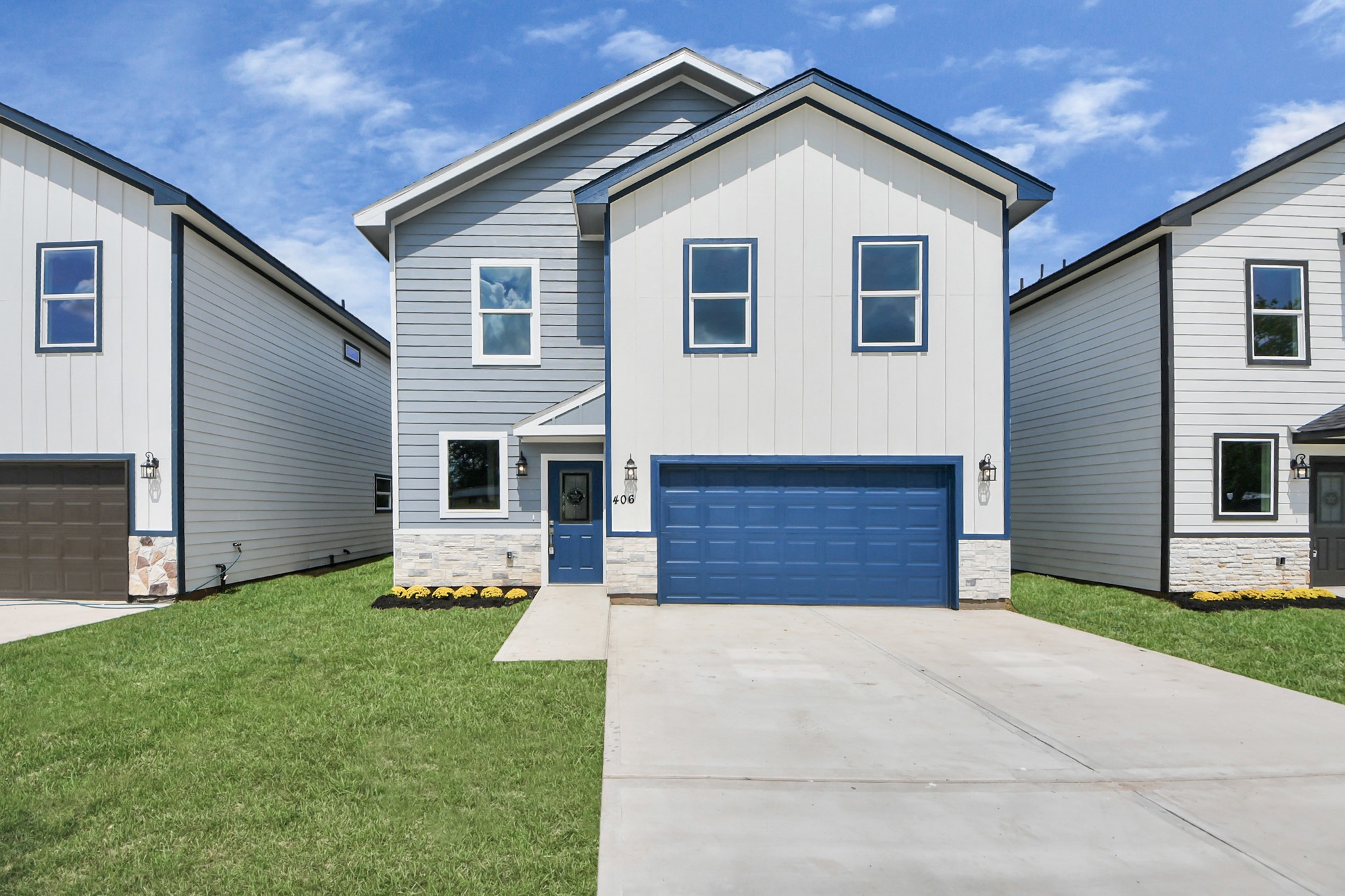 406 North 4th Street Beasley, TX 77417 - Photo 2 of 29 a front view of house with yard and trees in the background