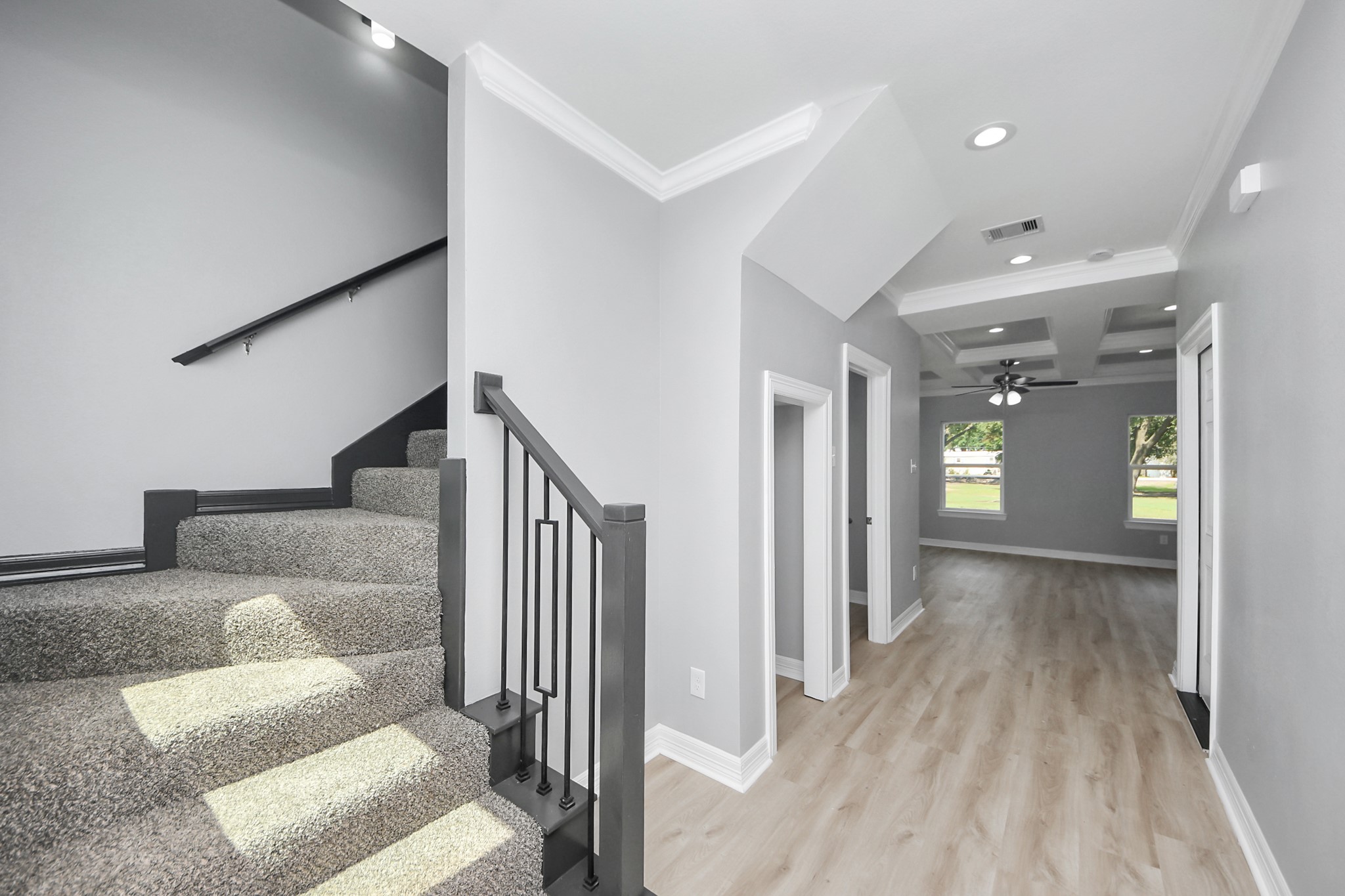 406 North 4th Street Beasley, TX 77417 - Photo 3 of 29 a view of a hallway with wooden floor and staircase
