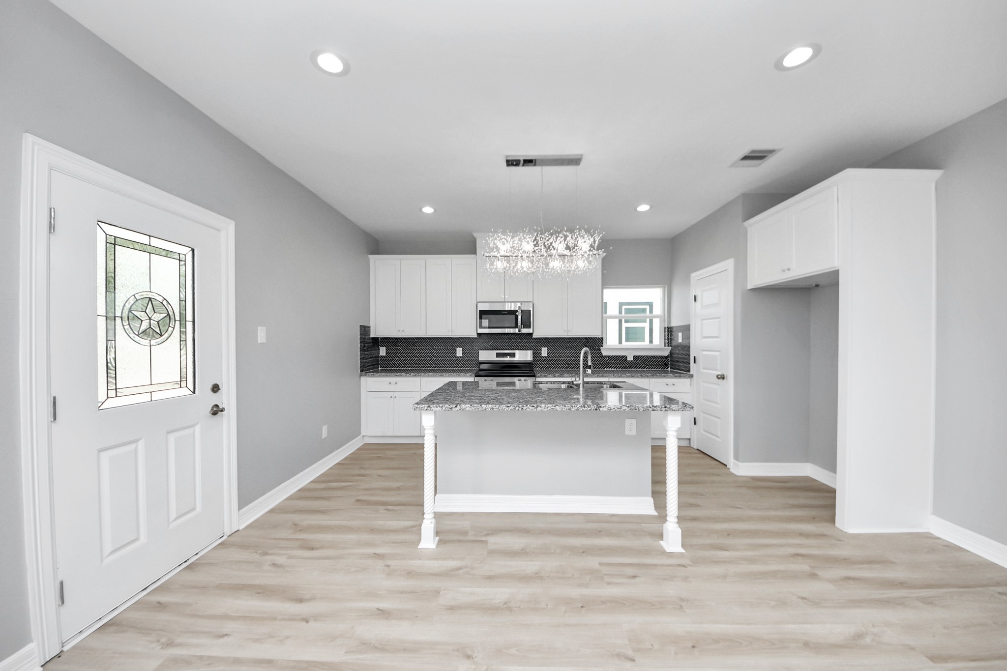 406 North 4th Street Beasley, TX 77417 - Photo 7 of 29 a kitchen with refrigerator and cabinets