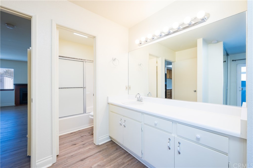 2010 Robles Perdido Drive, Unit A Los Osos, CA 93402 - Photo 13 of 28 a spacious bathroom with a double vanity sink and mirror