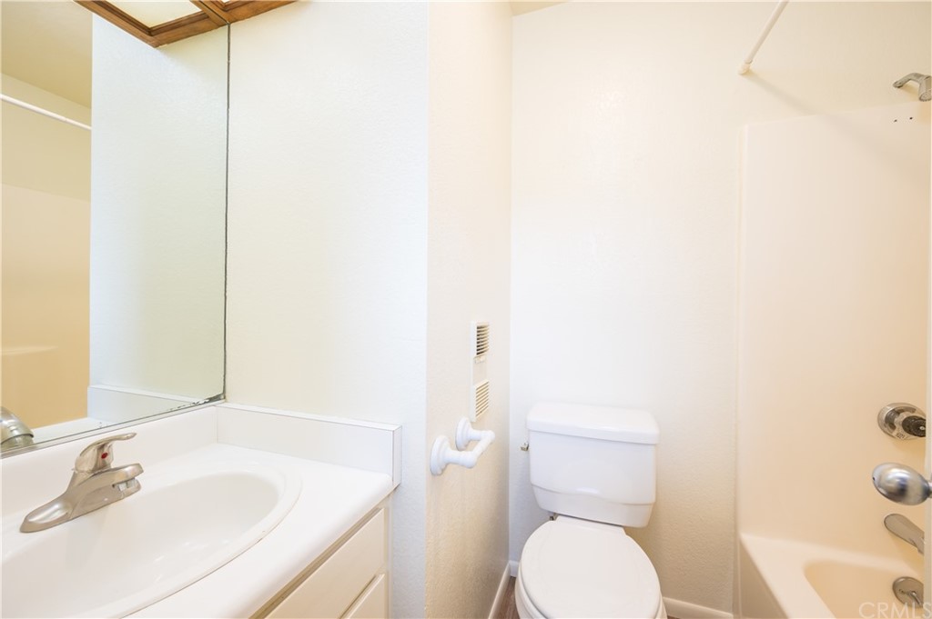 2010 Robles Perdido Drive, Unit A Los Osos, CA 93402 - Photo 18 of 28 a bathroom with a sink and toilet