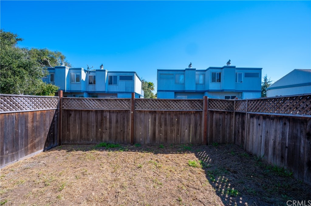 2010 Robles Perdido Drive, Unit A Los Osos, CA 93402 - Photo 23 of 28 a view of a backyard with wooden fence