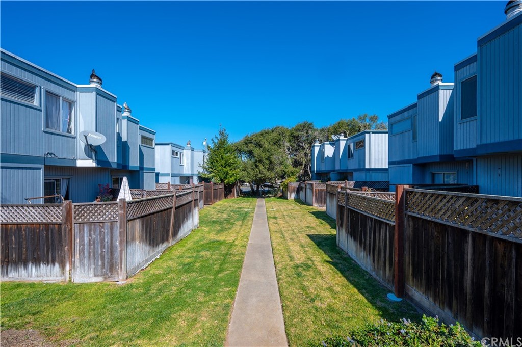 2010 Robles Perdido Drive, Unit A Los Osos, CA 93402 - Photo 26 of 28 a view of a swimming pool with a garden