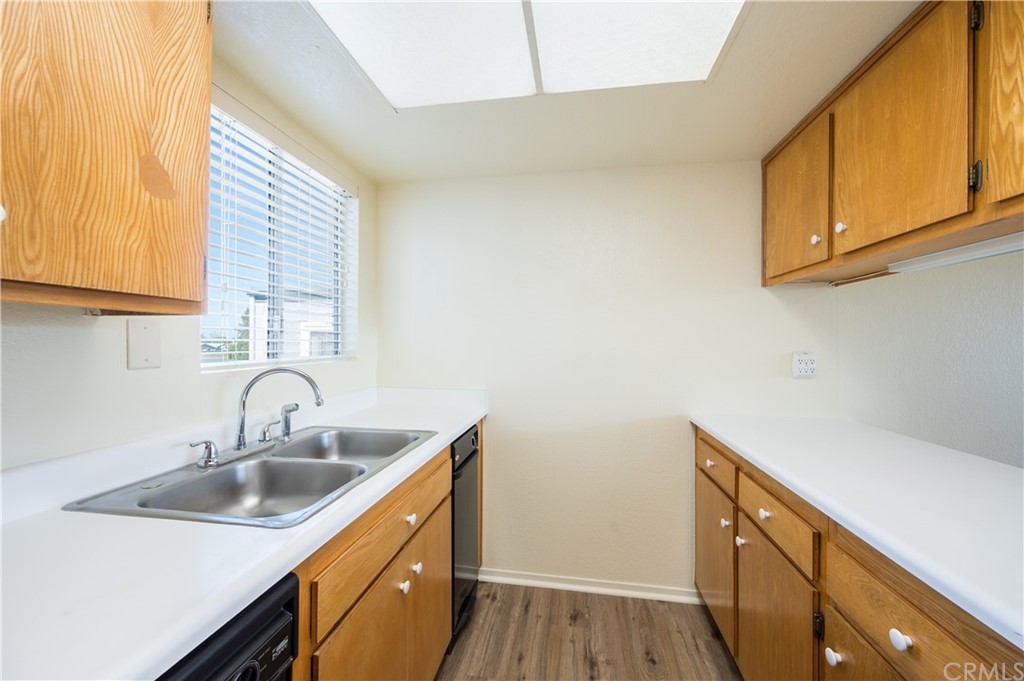 2010 Robles Perdido Drive, Unit A Los Osos, CA 93402 - Photo 10 of 28 a kitchen with sink cabinets and window