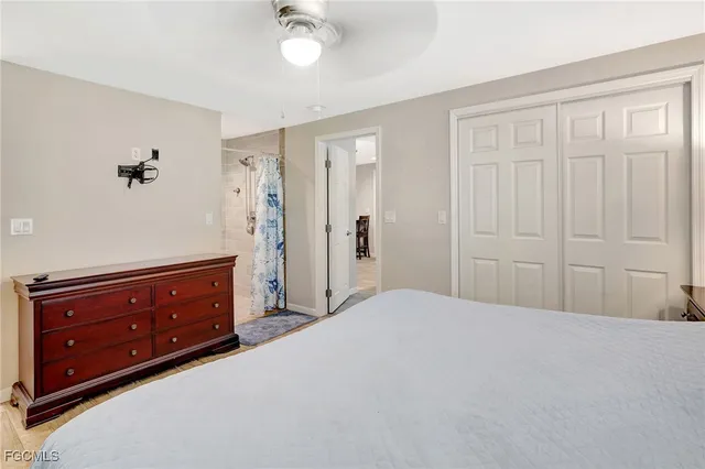 a bedroom with a bed and a dresser