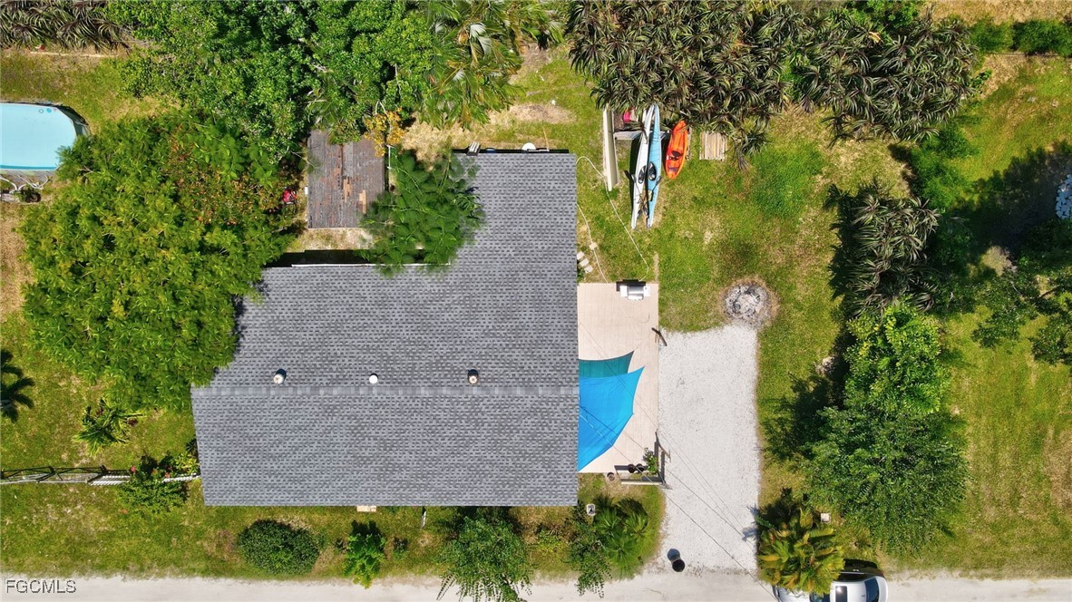 7462 Pentz Road Bokeelia, FL 33922 - Photo 21 of 22 an aerial view of residential house with outdoor space and trees all around