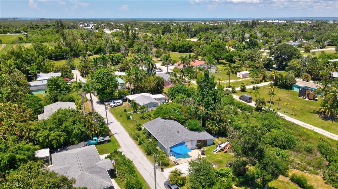 7462 Pentz Road Bokeelia, FL 33922 - Photo 22 of 22 an aerial view of a house with a yard