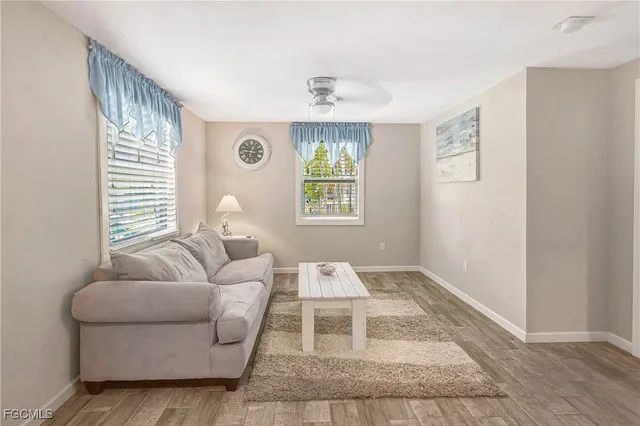 a living room with furniture and a window