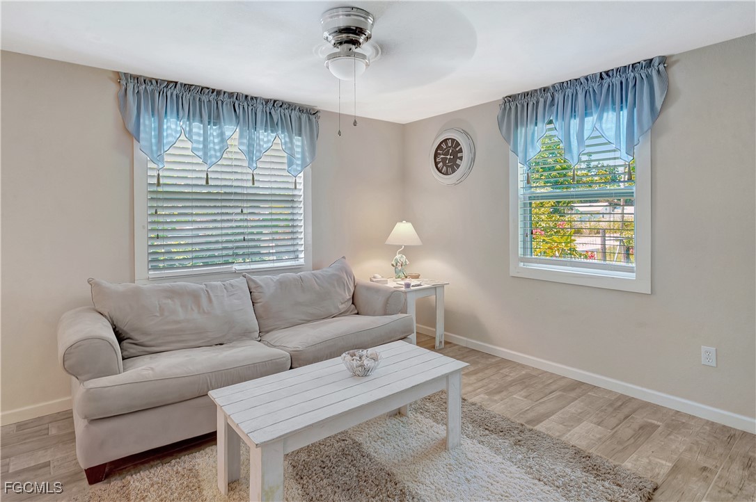 7462 Pentz Road Bokeelia, FL 33922 - Photo 5 of 22 a living room with furniture and a window