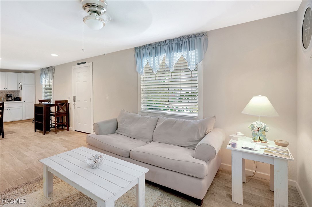 7462 Pentz Road Bokeelia, FL 33922 - Photo 6 of 22 a living room with furniture and a large window