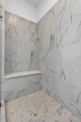 a white toilet sitting next to a white sink