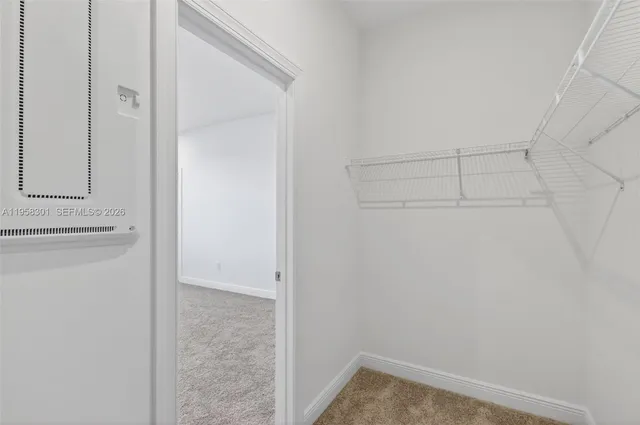 a bathroom with a shower curtain and a shower head