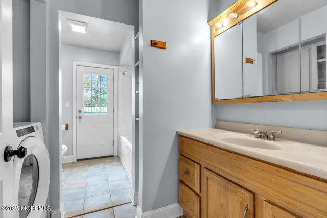 a bathroom with a sink and a mirror