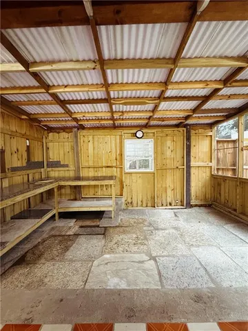 a view of a room with wooden walls