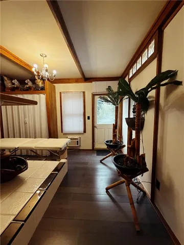 a view of a livingroom with furniture and a window