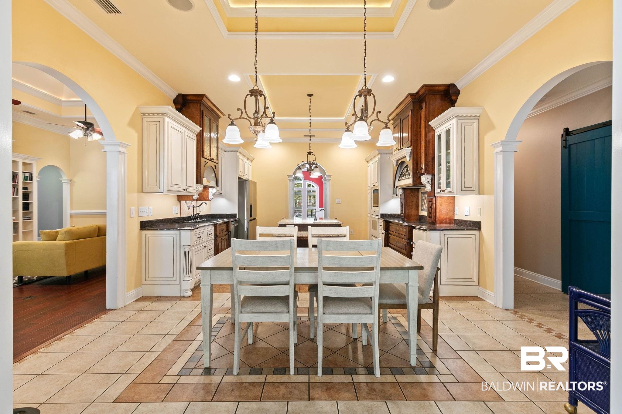3668 Claridge Road North Mobile, AL 36608 - Photo 45 of 100 Dining space with arched walkways, light tile patterned floors, a barn door, ornate columns, and recessed lighting
