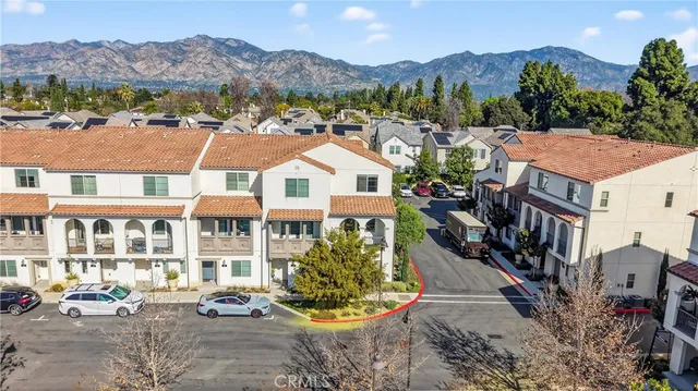 an aerial view of residential houses and outdoor space