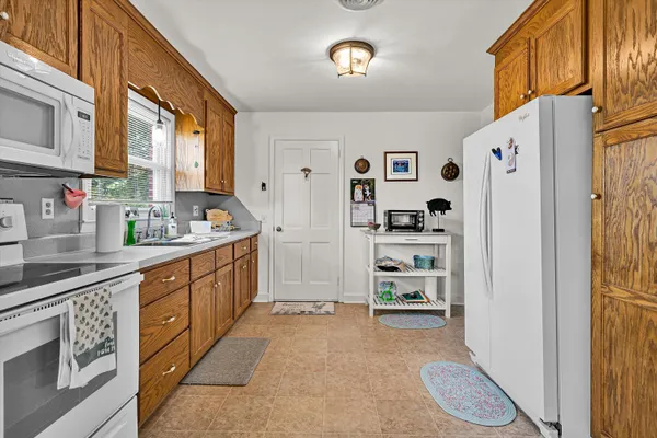 a kitchen with stainless steel appliances a refrigerator and cabinets