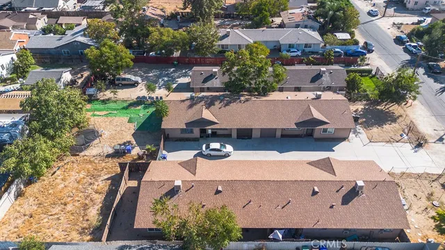 an aerial view of a house with yard