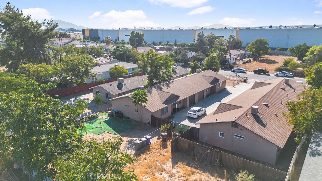 7771 McKinley Avenue Highland, CA 92410 - Photo 20 of 22 an aerial view of a house with a garden and lake view
