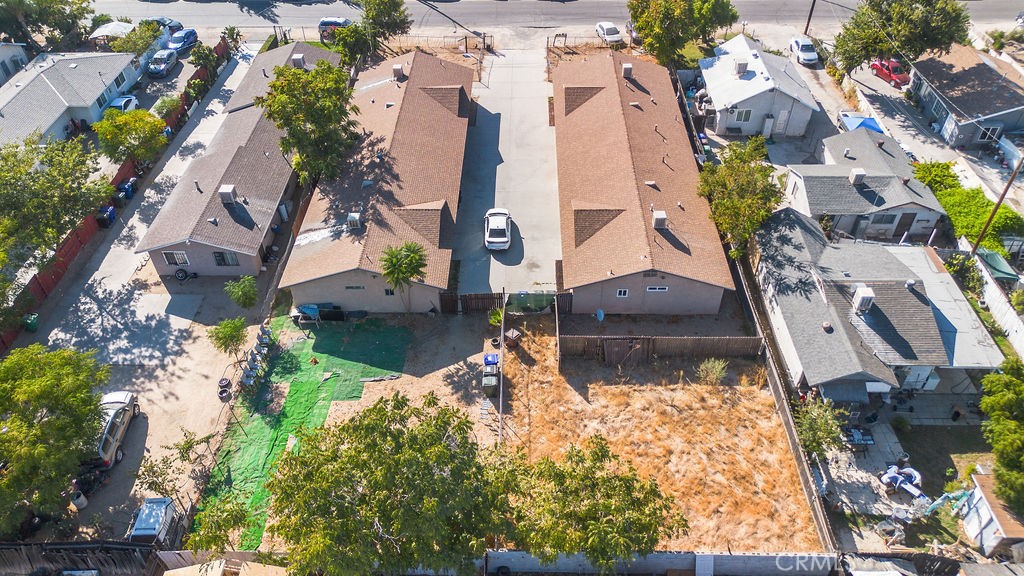 7771 McKinley Avenue Highland, CA 92410 - Photo 21 of 22 an aerial view of a house with a yard and large trees