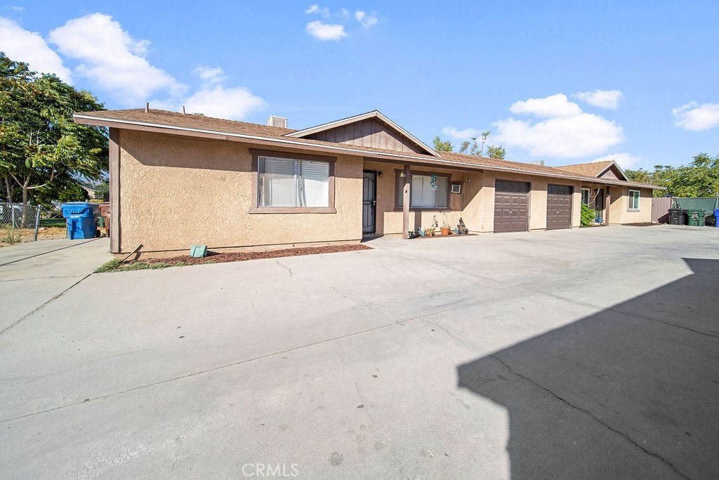 7771 McKinley Avenue Highland, CA 92410 - Photo 7 of 22 a front view of a house with a yard