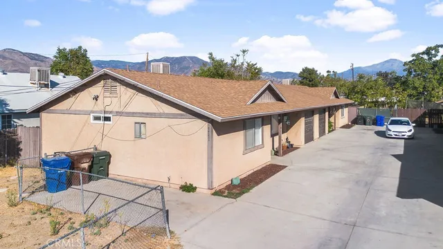 a view of multiple houses with a yard