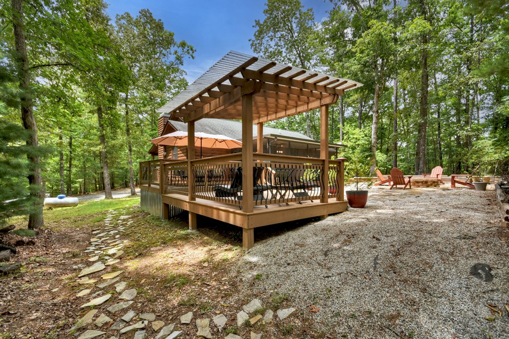 1044 Boulder Crk Road Murphy, NC 28906 - Photo 11 of 38 a view of a wooden deck with a yard