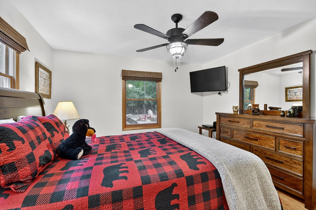 1044 Boulder Crk Road Murphy, NC 28906 - Photo 31 of 38 a bedroom with a bed and a flat screen tv