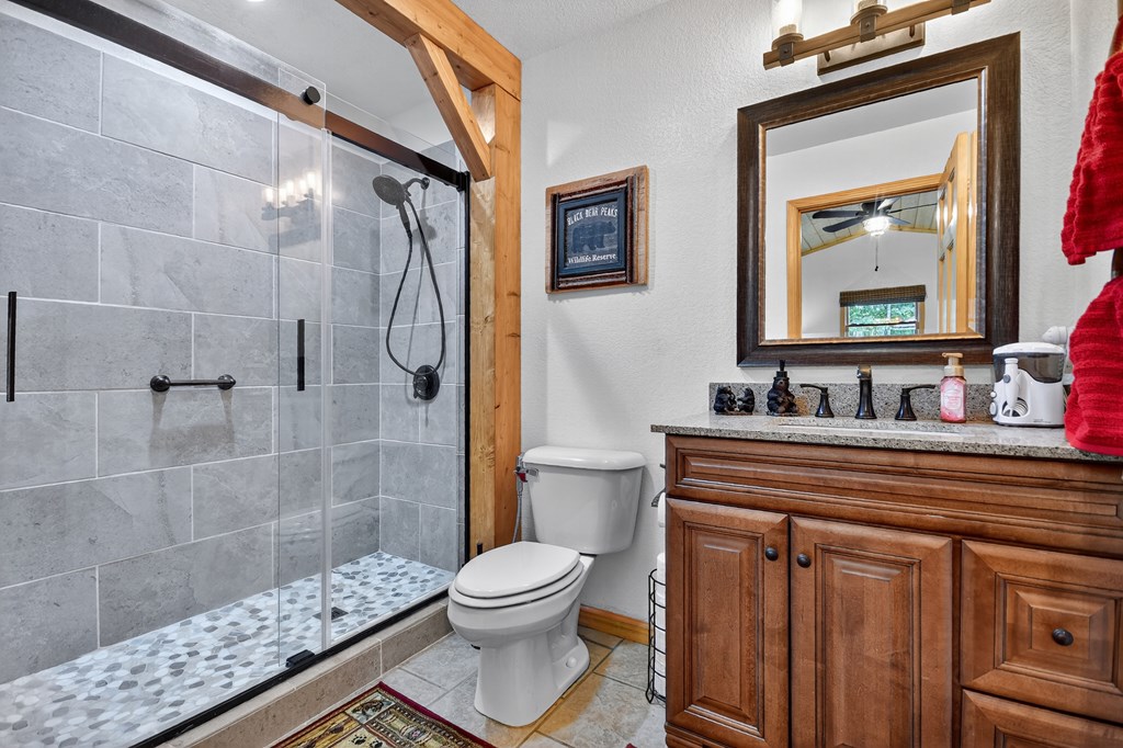 1044 Boulder Crk Road Murphy, NC 28906 - Photo 34 of 38 a bathroom with a sink a toilet and shower