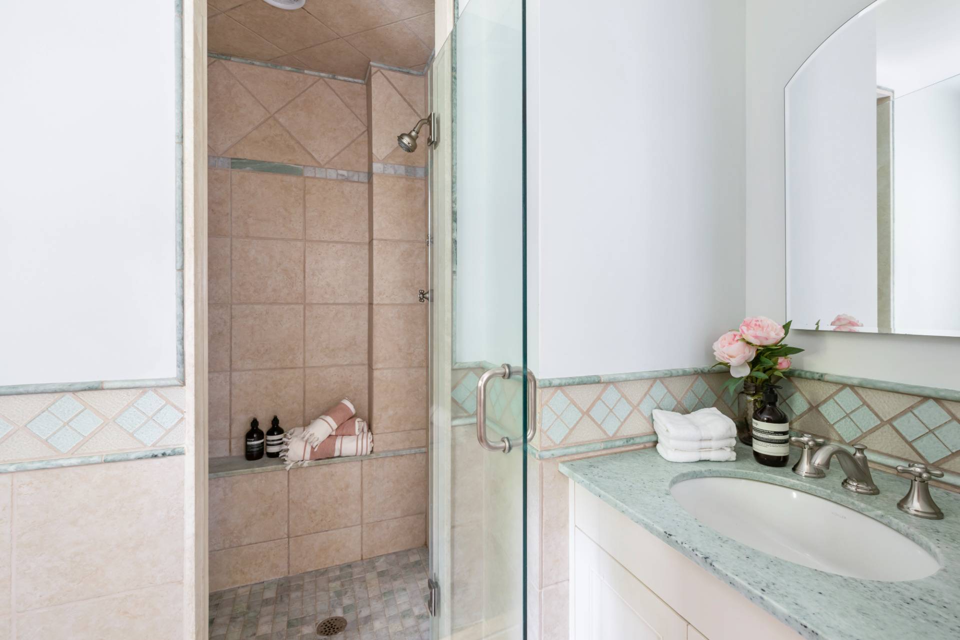 40 Ridge Road West Sag Harbor, NY 11963 - Photo 13 of 27 a bathroom with a granite countertop shower a sink and vanity