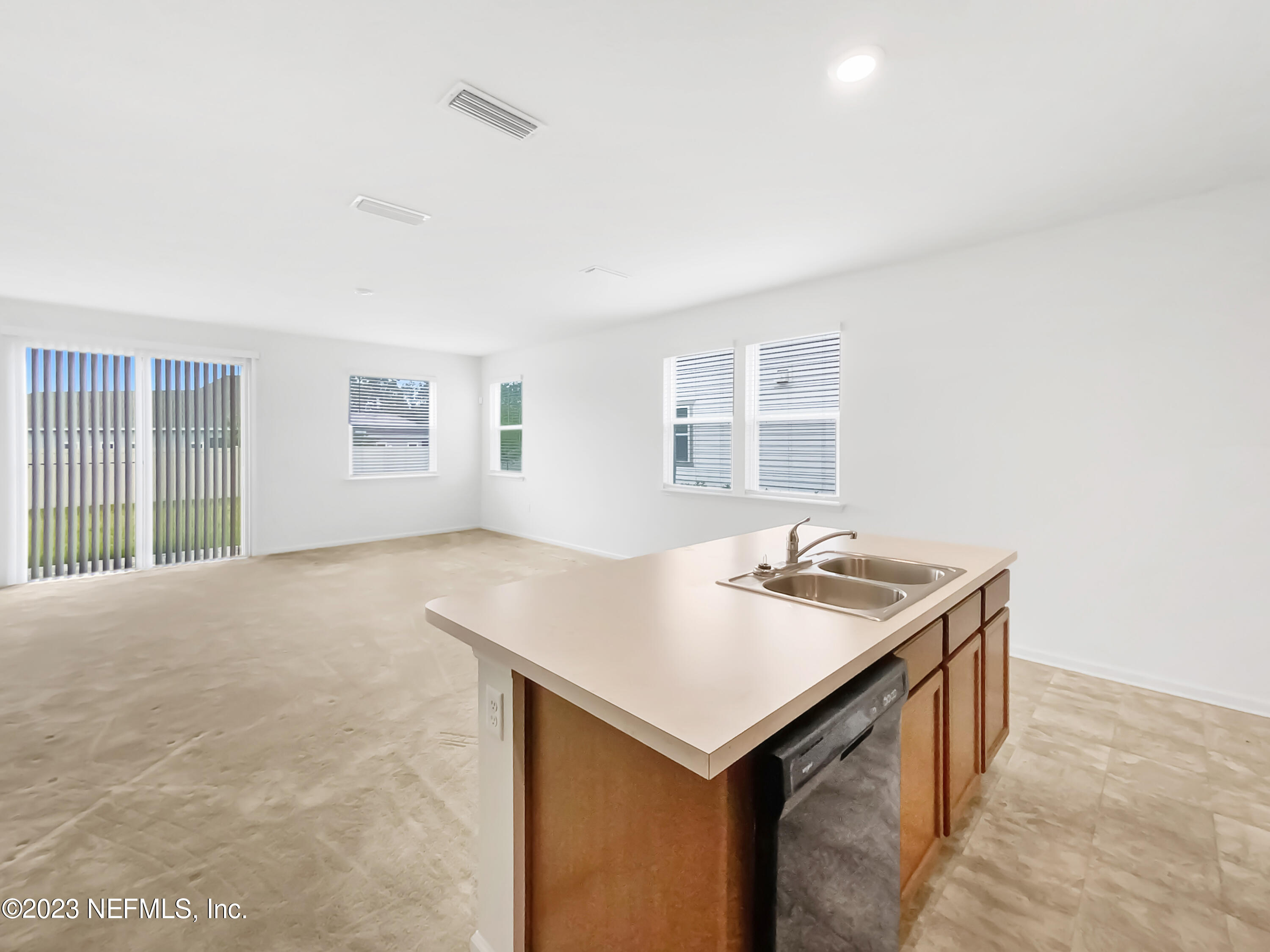 7909 Merchants Way Jacksonville, FL 32222 - Photo 12 of 19 a kitchen with a sink cabinets and window