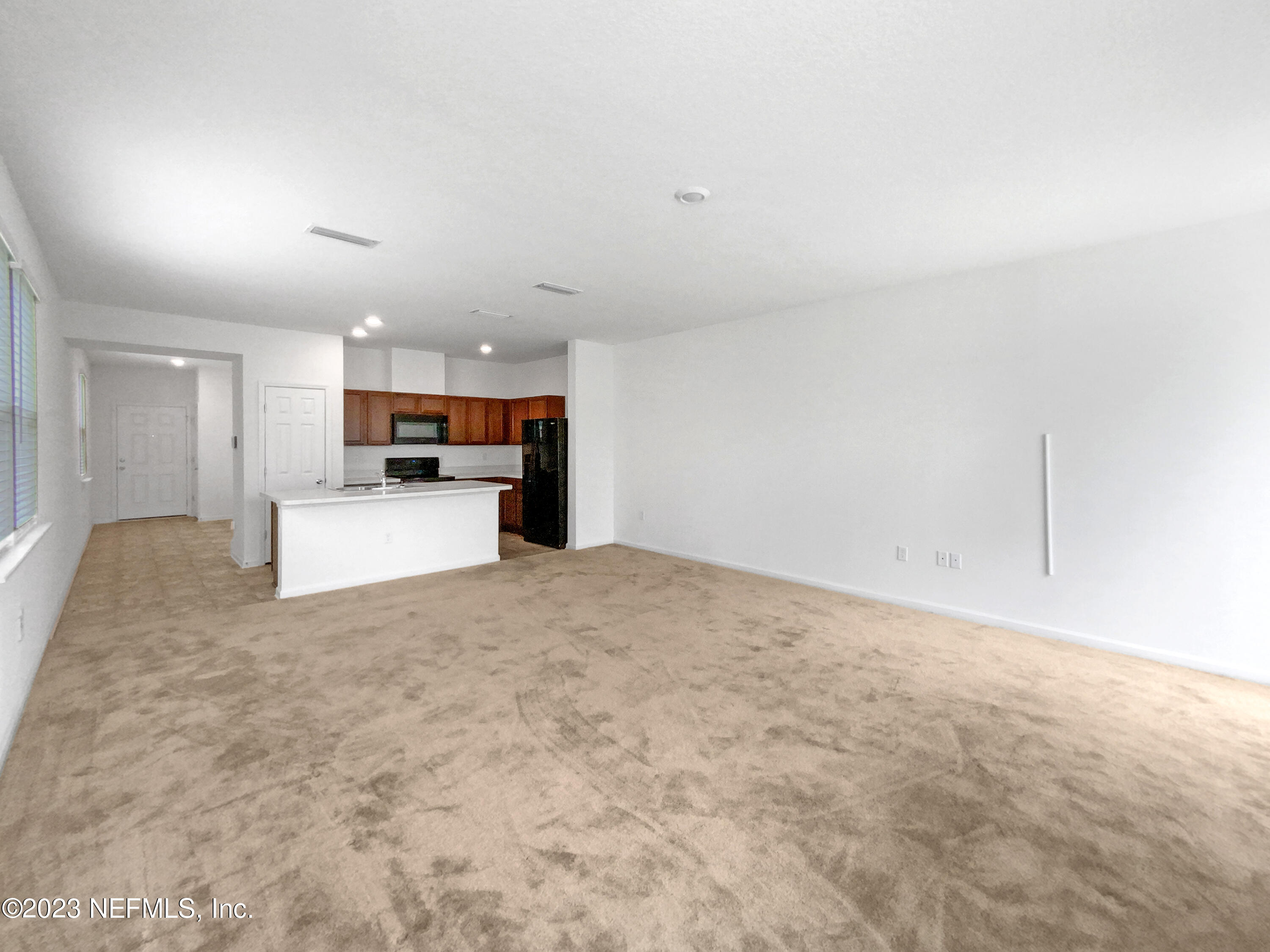 7909 Merchants Way Jacksonville, FL 32222 - Photo 15 of 19 a view of kitchen and refrigerator