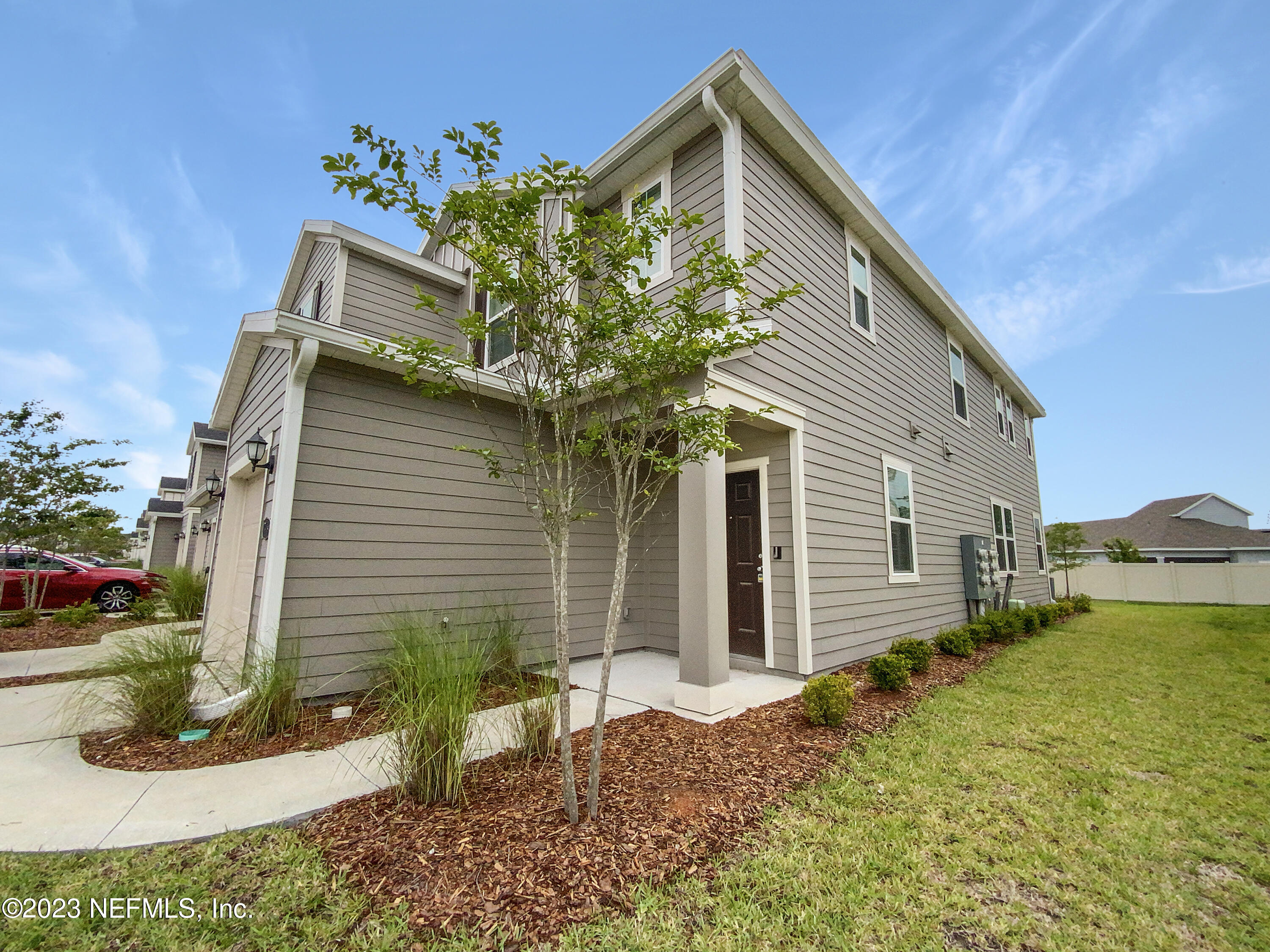 7909 Merchants Way Jacksonville, FL 32222 - Photo 6 of 19 a view of a house with a yard