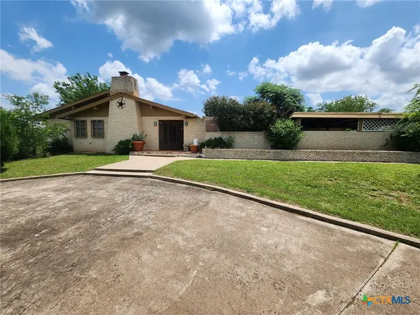 a house view with a garden space