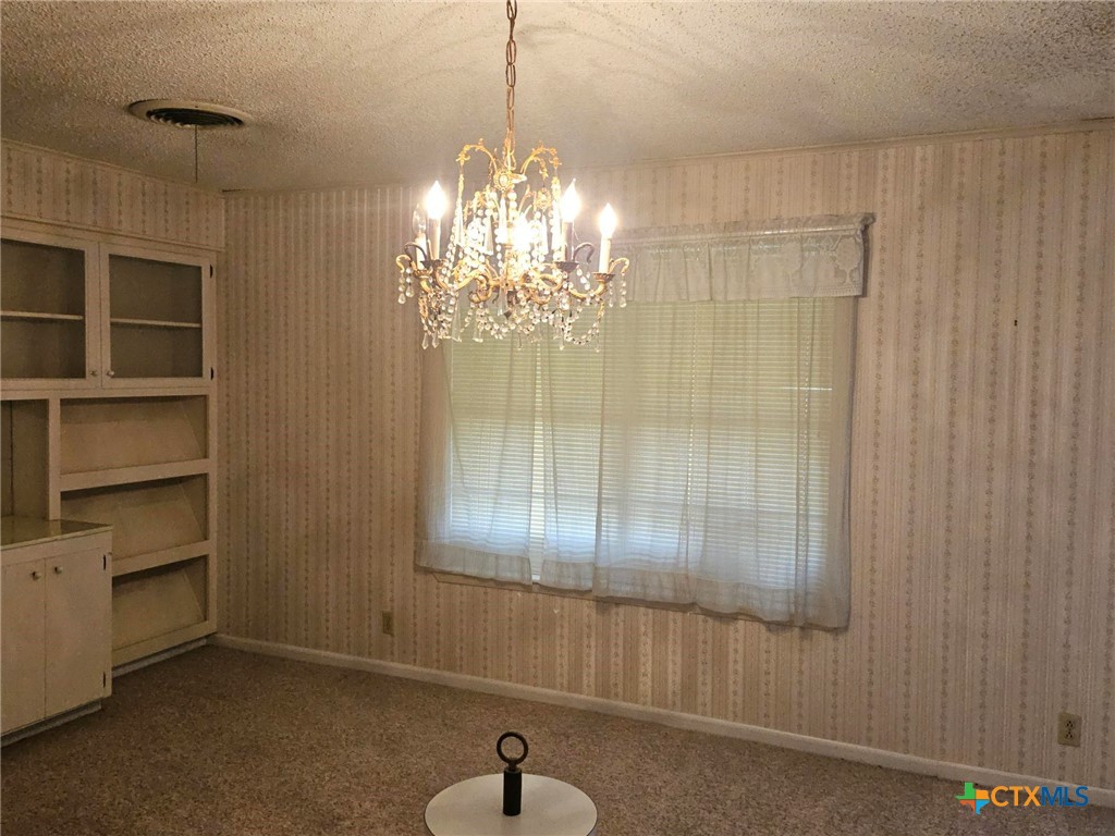 601 North Rhomberg Street Burnet, TX 78611 - Photo 14 of 42 a view of a chandelier in a room