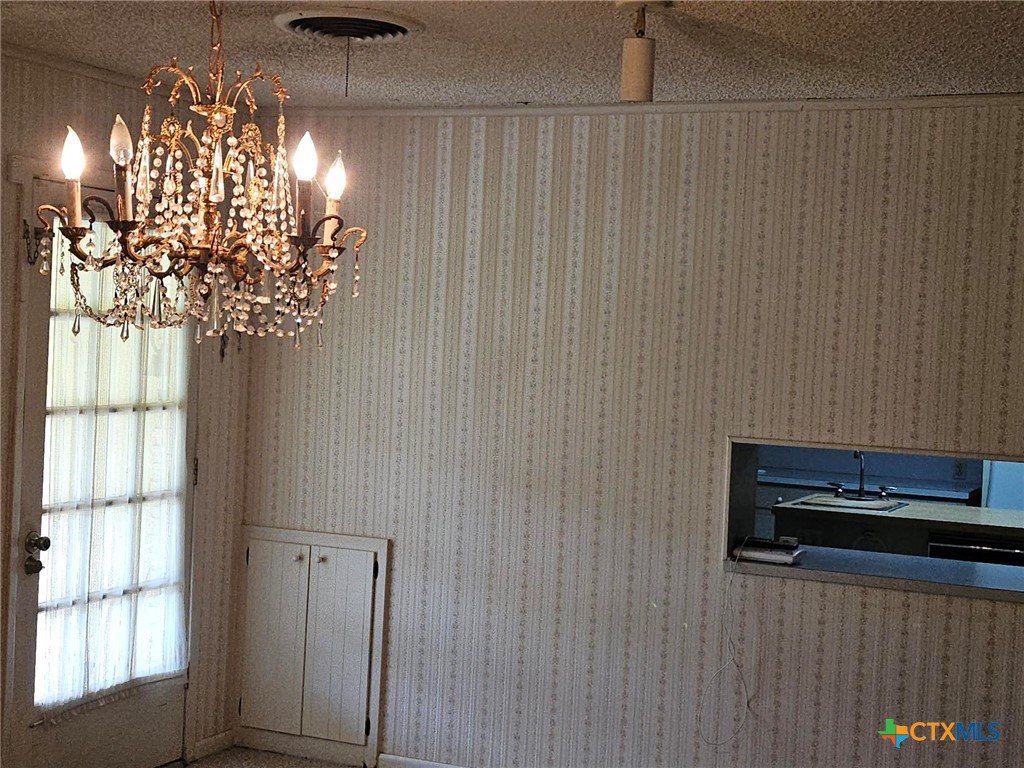 601 North Rhomberg Street Burnet, TX 78611 - Photo 15 of 42 a vase of flowers sitting on a table near a window