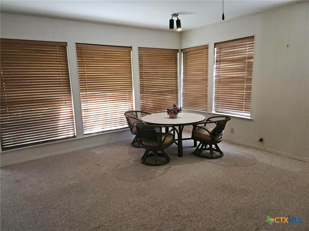 601 North Rhomberg Street Burnet, TX 78611 - Photo 20 of 42 a dining room with furniture and windows