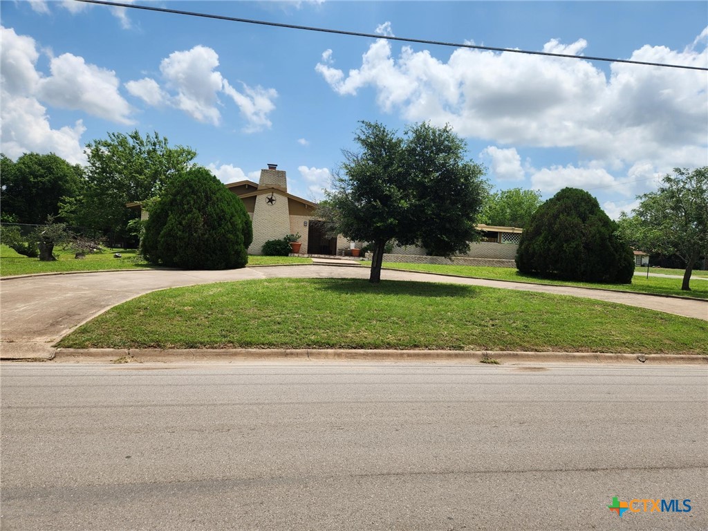 601 North Rhomberg Street Burnet, TX 78611 - Photo 2 of 42 a front view of a house with a yard and garage